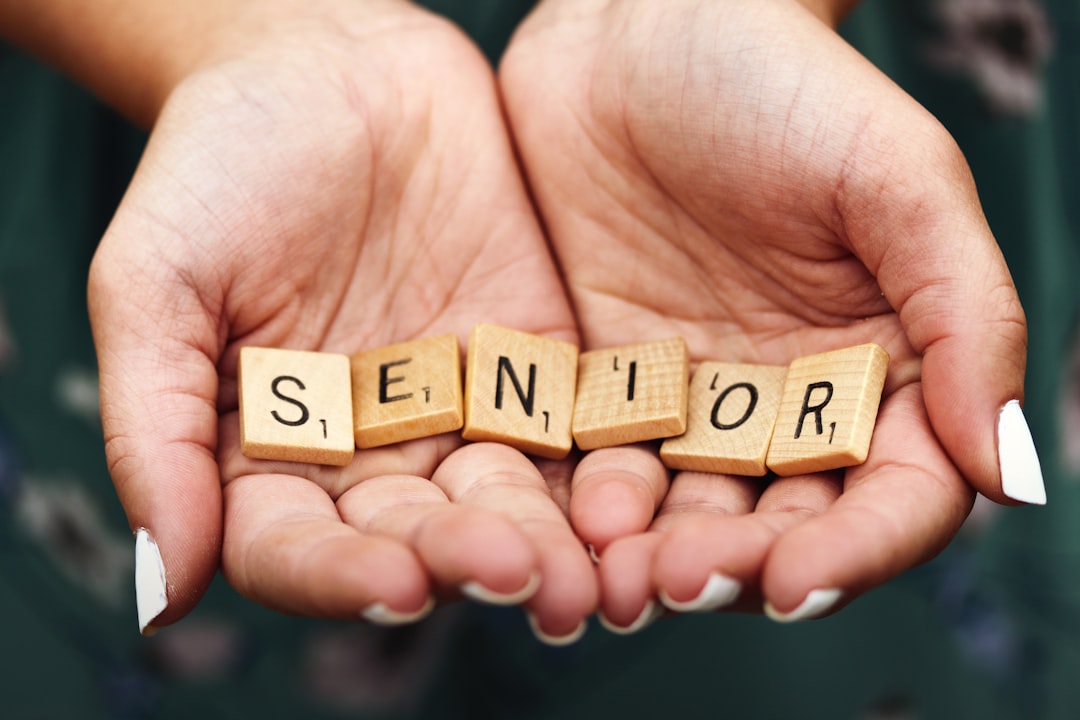 Macro shot of teen girl with manicured fingernails holding scrabble letters spelling the word SENIOR in the palms of her cupped hands.

This was my first shot during a senior portrait session a few years ago and taken spur of the moment in the parking lot at Kohler-Andrae State Park in Sheboygan, Wisconsin.